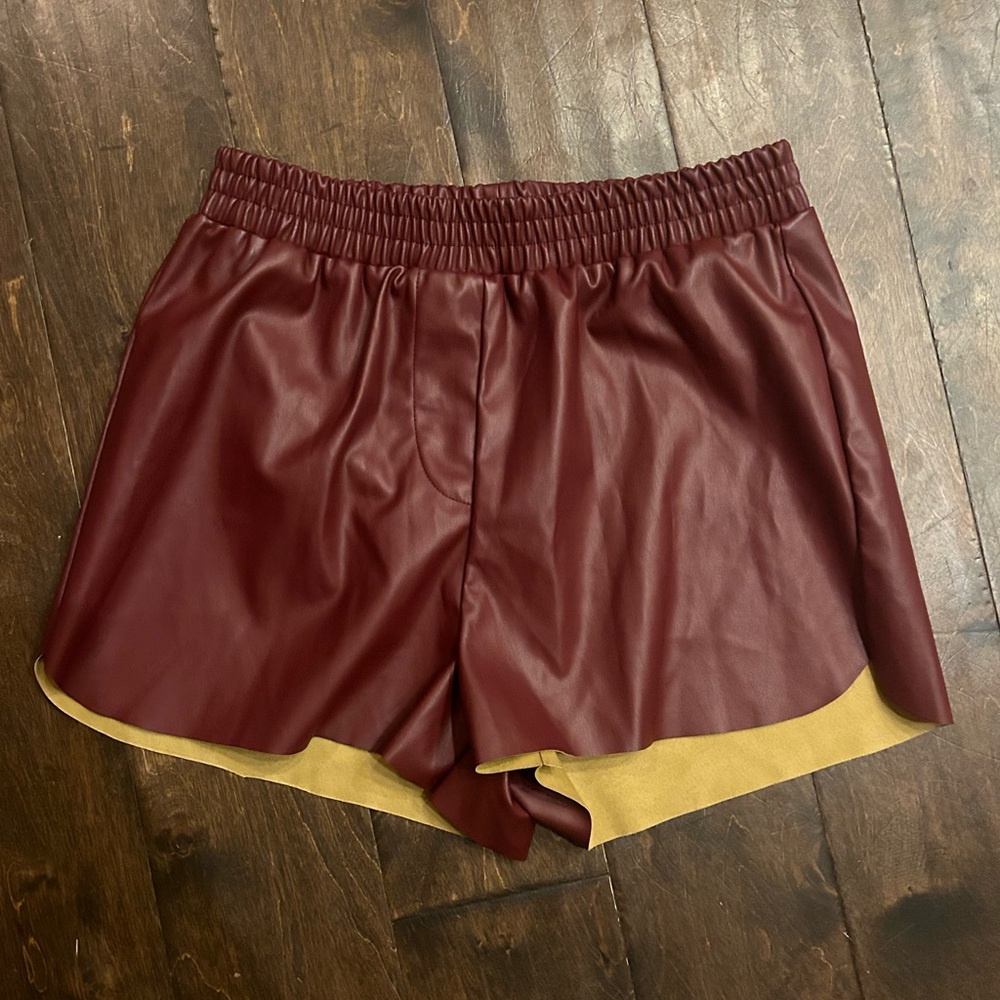 Francesca’s burgundy red faux leather shorts